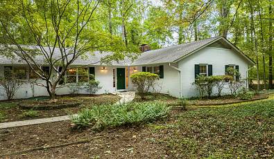 WELCOMING CHAPEL HILL HOME WITH PANORAMIC VIEWS OF WOODED LOT