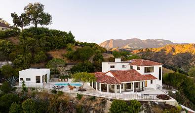 Spanish revival on private promontory with unobstructed views in Hollywood